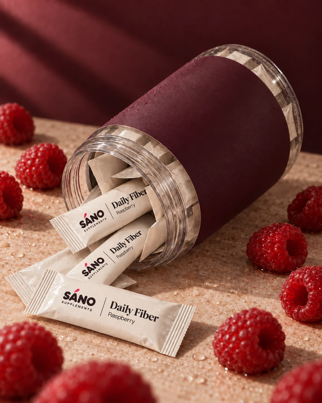 The Sáno jar on its side with daily sachets spilling out across a stone surface